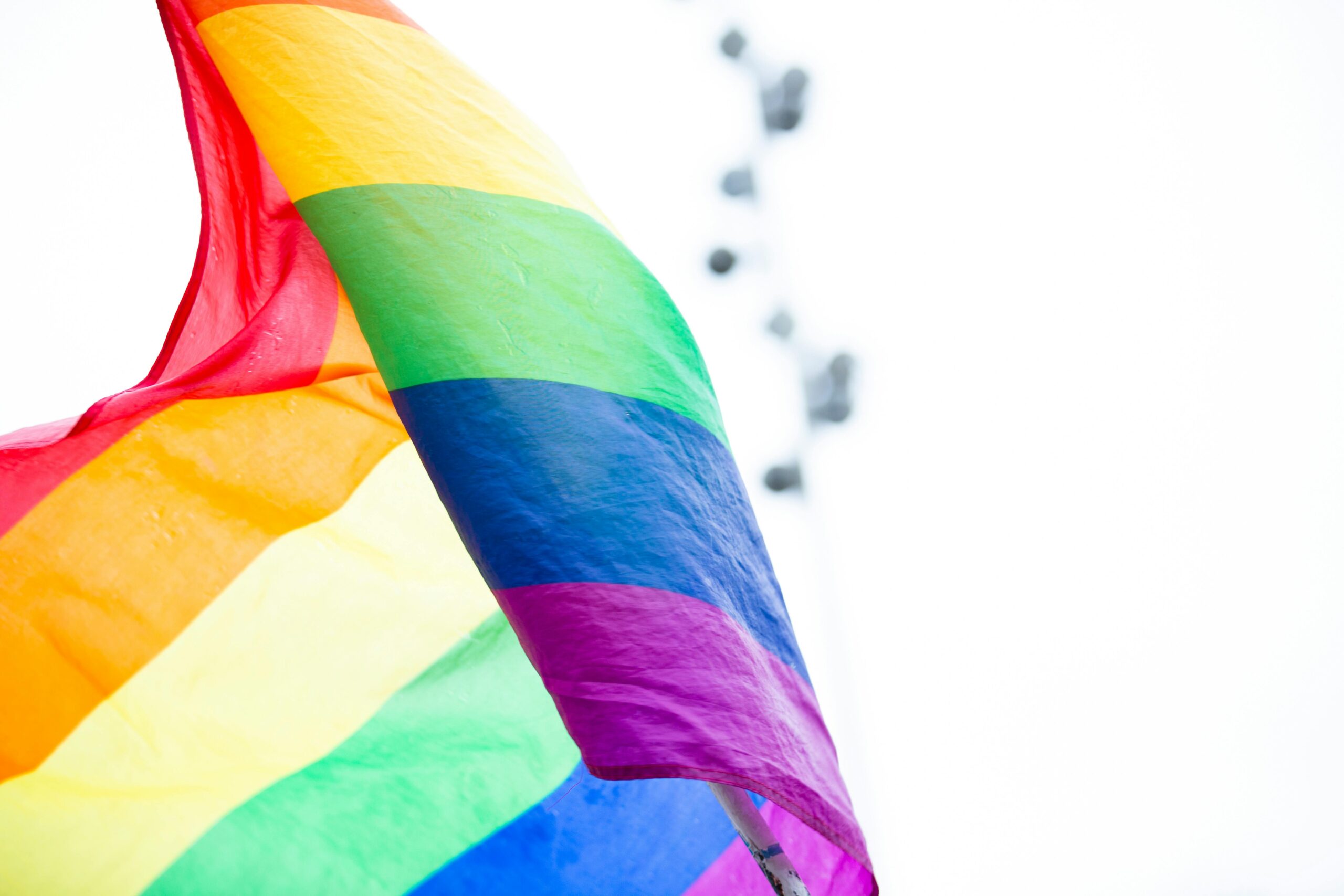 a pride flag waves in the breeze