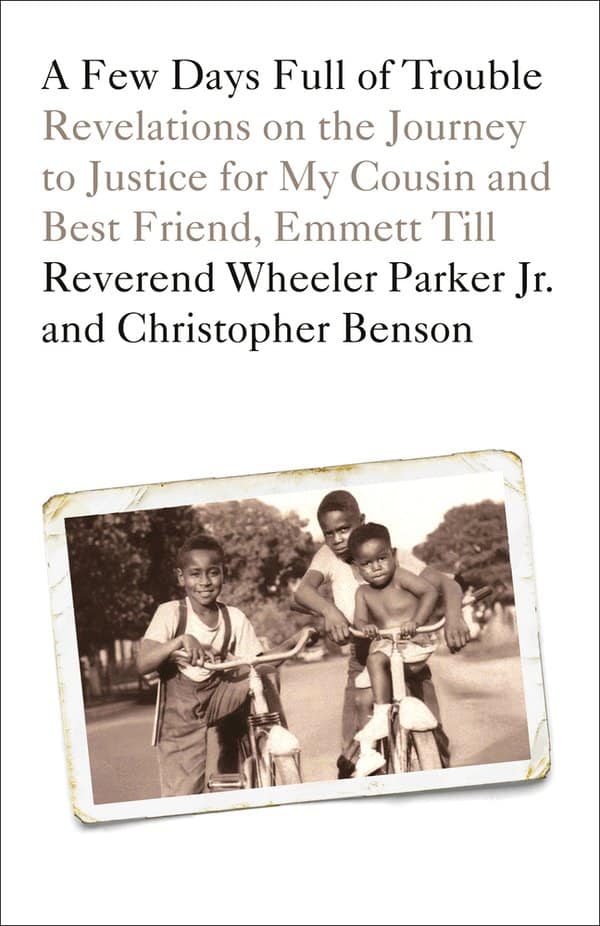 a black and white photo of three young African American boys, including Emmett Till and his cousin, Rev. Wheeler Parker Jr, riding bikes together