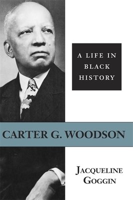 a black and white photo of Dr Carter Woodson is the cover of the book. He is older in this photo, with white hair on the sides of his head. He is wearing a dark suit with a brightly colored tie.