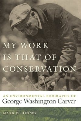The cover of the book is a black and white photo of an elderly George Washington Carver, leaning over some plants